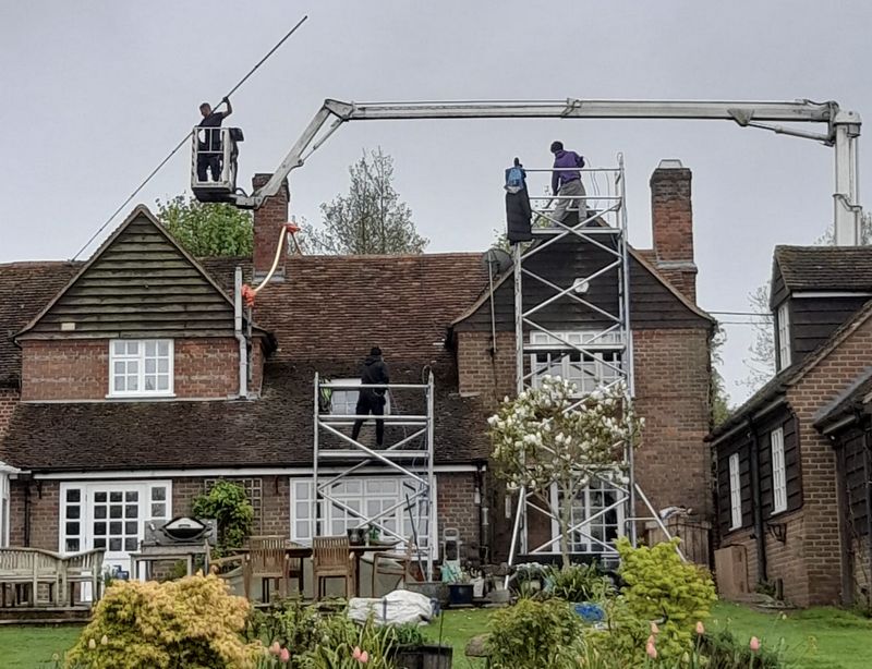 The Moss Cleaners using cherry picker and scaffolding to clean roof safely and professionally in 40 Mandeville Rd, Northolt UB5 5BL, UK, 40 Mandeville Rd, Northolt UB5 5BL, UK